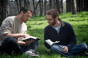 Two_people_reading_Bible